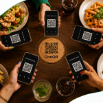 Group of people sitting around a dining table with food, holding up smartphones to scan a central One QR coaster to order and pay.